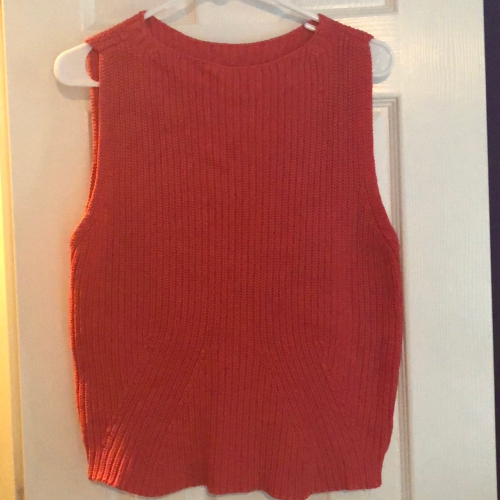 an orange tank top